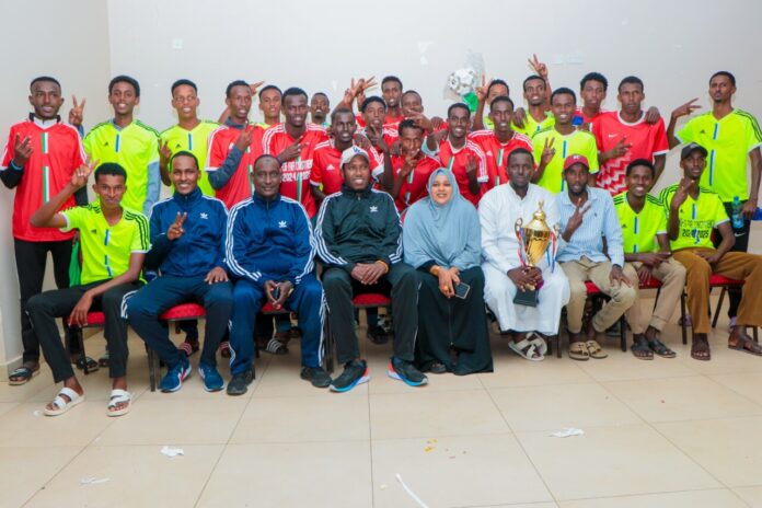 Fafi MP Sala Yakub (in white cap) with members of Borehole 5 Secondary School football team.