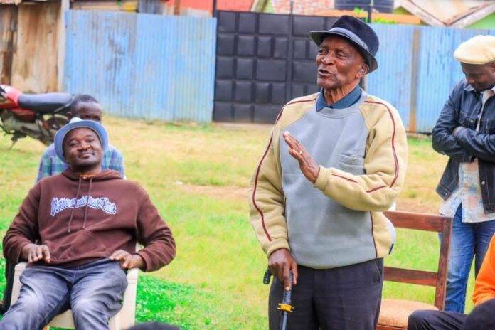 Retired Senior Chief 'Sir' Edward Karanja (center) and son, Waithaka Ward MCA Anthony Kiragu (seated)